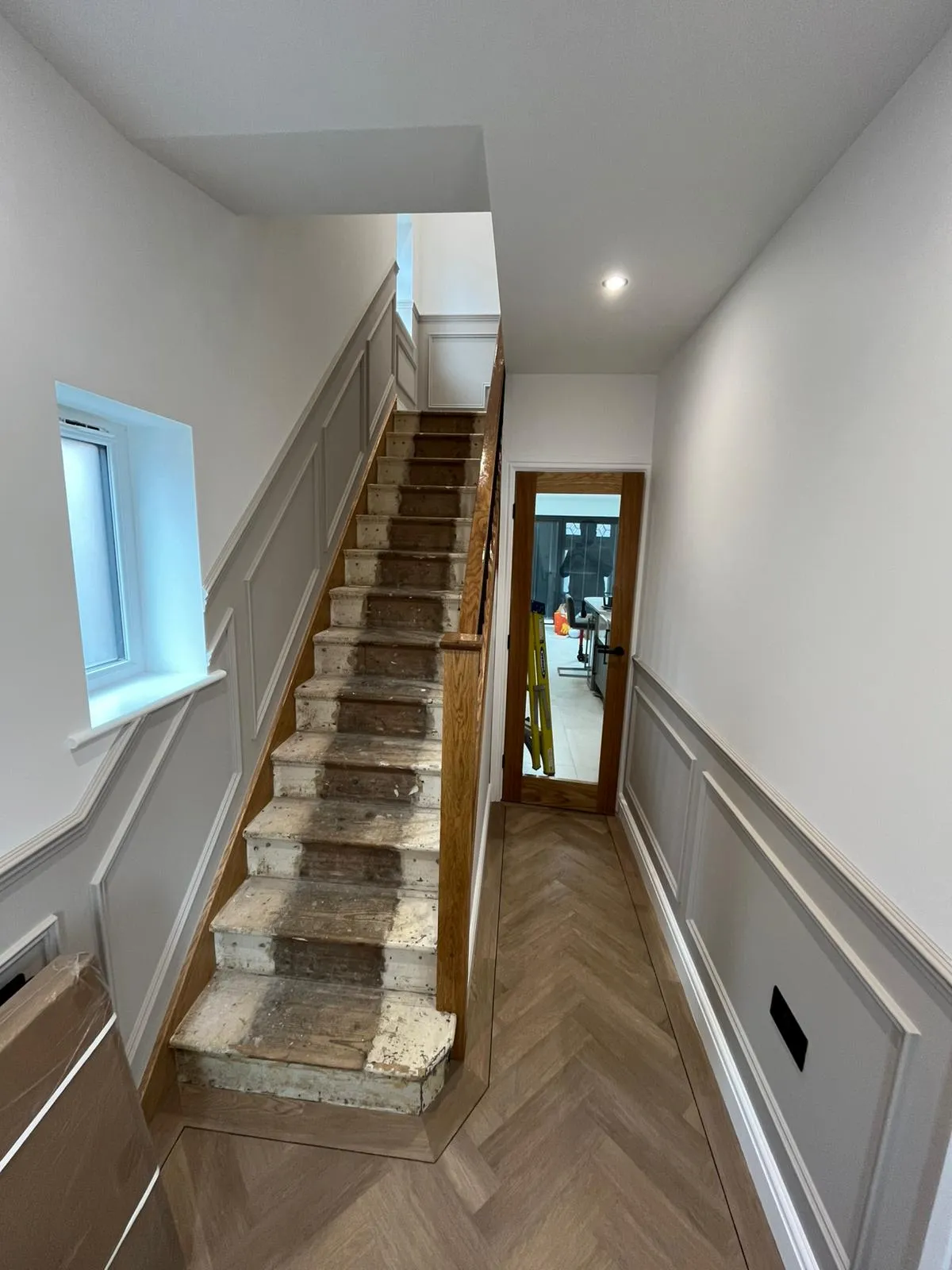 A beautifully decorated hallway with wall panelling by Lockwood's Decorators